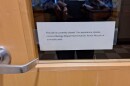 Image of a door with a note on it informing the reader that the lab is currently closed