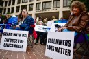 Former coal miners and families of deceased ones held a rally outside the Department of Labor in October, urging the administration to defend and enforce a safety rule that limits worker exposure to toxic silica dust.