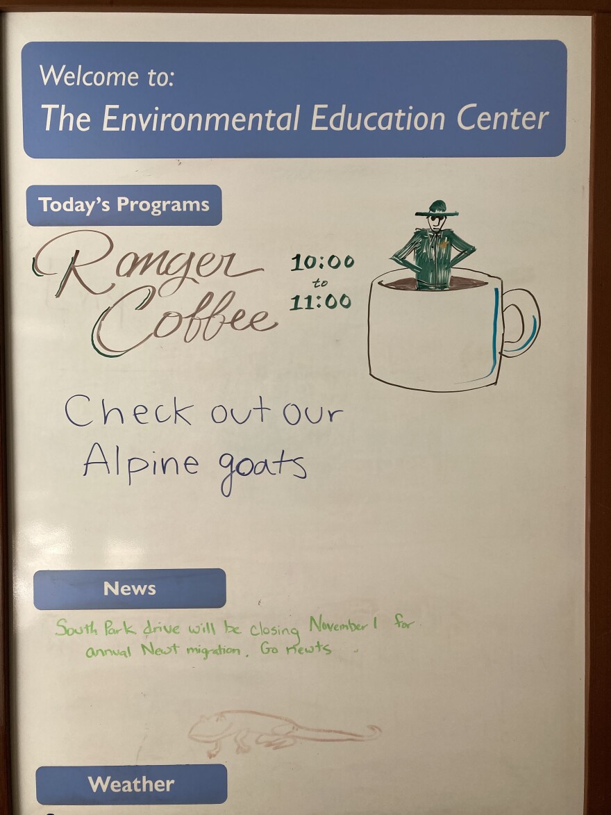 A post about there morning's Ranger Coffee event on the whiteboard at the entrance to the Environmental Education Center