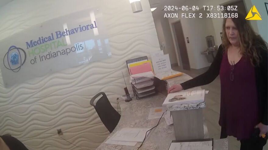 Tina Blackburn, Jessica Ravellette’s mother, speaks to staff at the Medical Behavioral Hospital of Indianapolis in Greenwood with a Greenwood police officer on Tuesday, June 4, 2024.