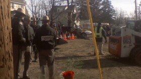 New York State Troopers assess the aftermath of the crash of Flight 3407 in Clarence.