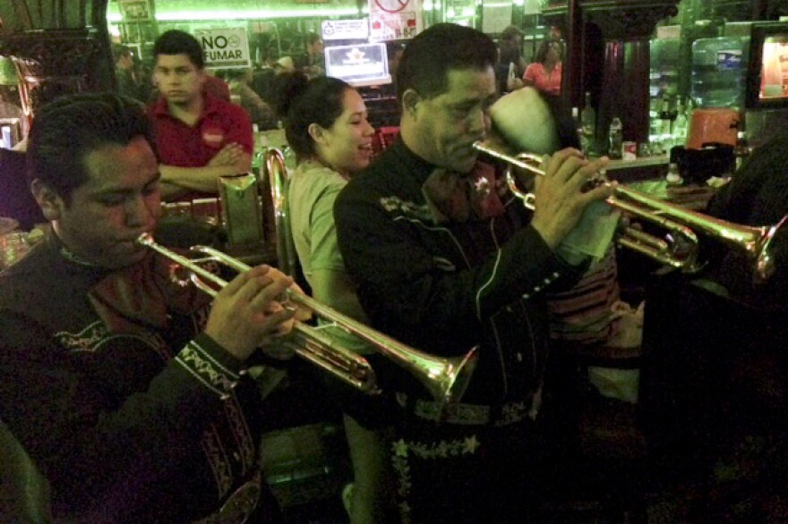 The Mariachi Imperial serenades the crowd at the renowned Kentucky Club in Juarez. Frequented in the past by Marilyn Monroe, Frank Sinatra and a pantheon of Mexican movie stars and boxers, the club managed to stay open during the recent years of violence.