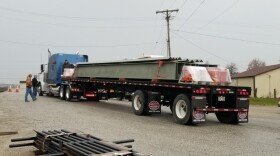 The first steel bridge replacement beams prepare to leave Frankfort, KY.