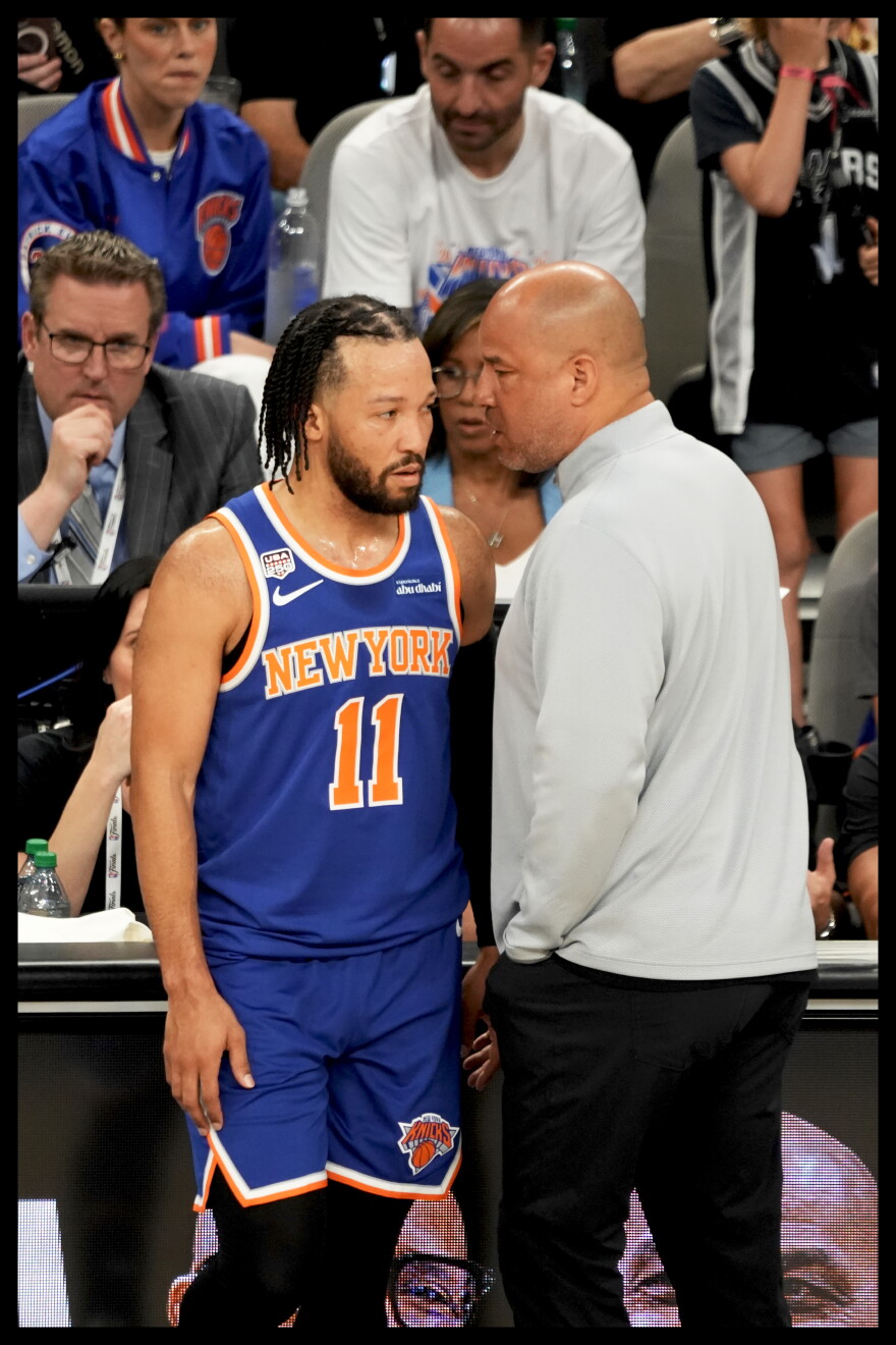 Knicks coach, Rick Brunson speaks to son and Knicks guard, Jalen Brunson during the 2026 NBA Finals.