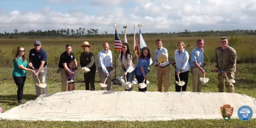 L-R: Kelly Cox, Mark Perry, Dr. Wes Brooks, Superintendent Pedro Ramos, Governing Board Chairman Chauncey Goss, Asst. Secretary Shannon Estenoz, Governing Board Member Cheryl Meads, Director Drew Bartlett, Governing Board Member Charlette Roman, Eric Eikenberg, and Lt. Col. Todd Polk.