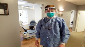 Dr. Michael Hull reopened his dentist practice this week with new protective measures in place.