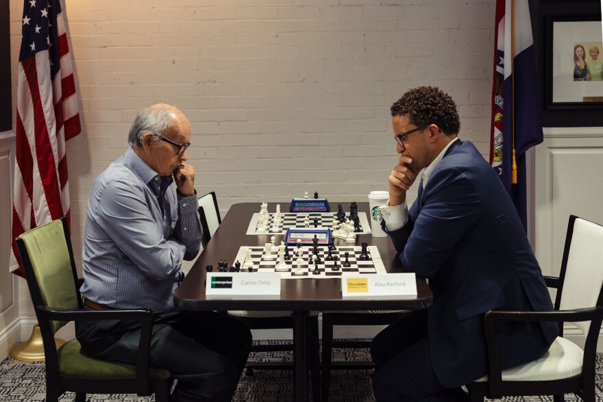 Carlos Ortiz of Enterprise (left) and Alex Kerford of Edward Jones face off in a St. Louis Corporate Chess League meeting at the St. Louis Chess Club.