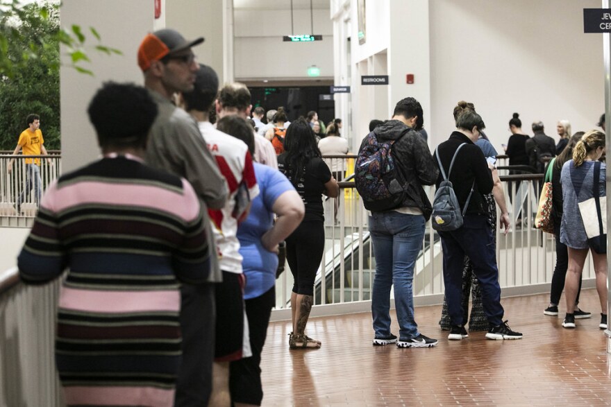 Voters line up to cast ballots in the primaries, at Austin Community College's Highland Campus on March 3. 