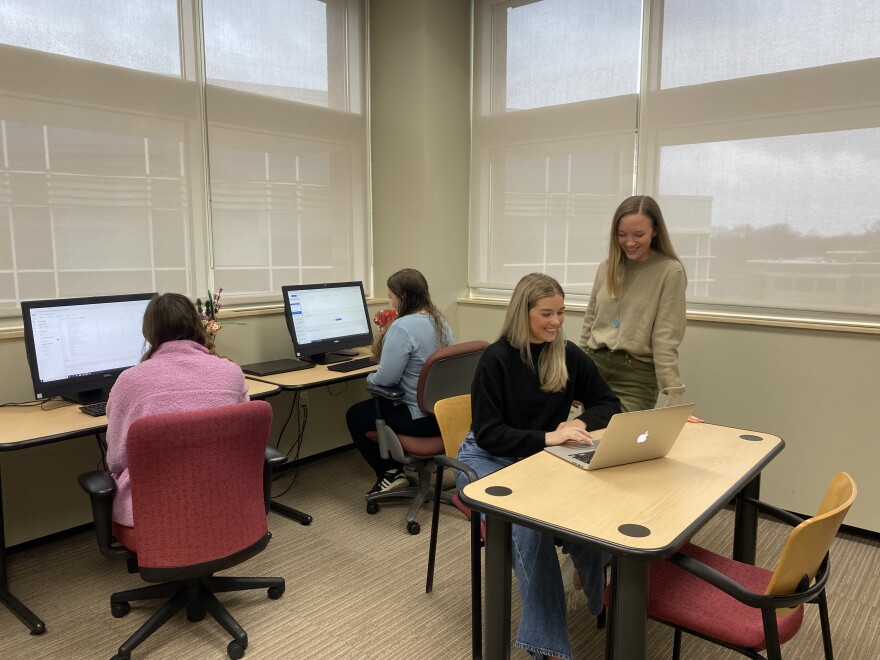 WMU Speech, Language and Hearing Science majors are designing an app for a study on discrimination for people who stutter. Instructor, Hope Gerlach-Houck oversees graduate student Taylor VanAllsburg, at the computer.