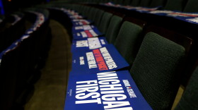 Michigan First signs lay on seats before a rally for Michigan Senate candidate Abdul El-Sayed Sunday, Oct. 25, 2026, in Grand Rapids, Mich. (AP Photo/Kristen Norman)