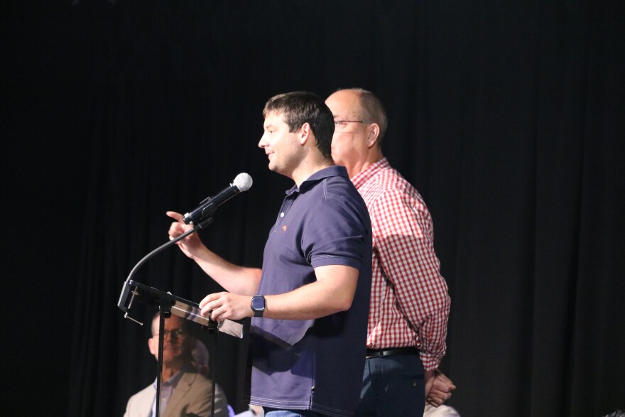 Eric Chaney, judge-executive for Boyd County, addresses the crowd at a data center town hall. Bobby Hall, judge-executive for Greenup County, also answered questions from the public about the future TeraWulf data center.