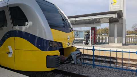 A DART train waits at the Carrollton Silver Line station.