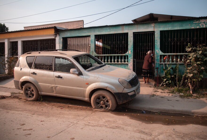 The Ciudad Planeta neighborhood of San Pedro Sula was turned into a vast muddy lake by the 2020 hurricanes. Sights like this vehicle ruined by the flood are still common.