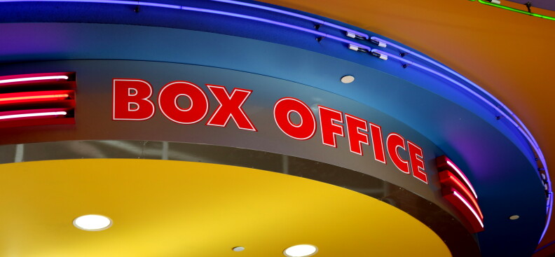 A lighted box office sign with red and blue LED lights in a line.