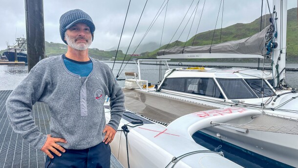 Luke Moloney stands in front of his sailboat, the Mizuya, docked in Unalaska on July 18.