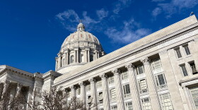 A worm's eye view of the exterior of the dome of the Missouri state capitol building. 