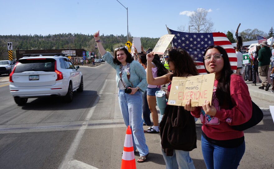 Many protesters said they were anxious and angry about the Trump administration's immigration crackdown and the war with Iran during a protest along Route 66 in Flagstaff on Sat, March 28.