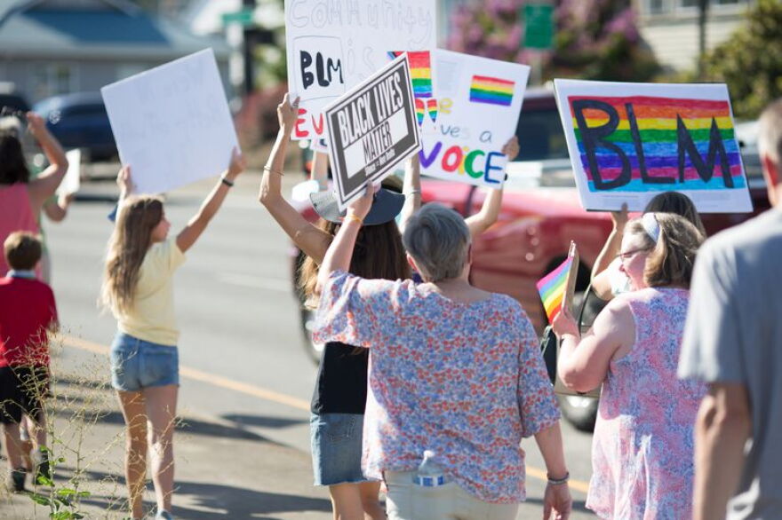 FILE: Families, staff and community members marched in support of the LGBTQ+ community and Black Lives Matter ahead of a Newberg school board meeting in August 2021.