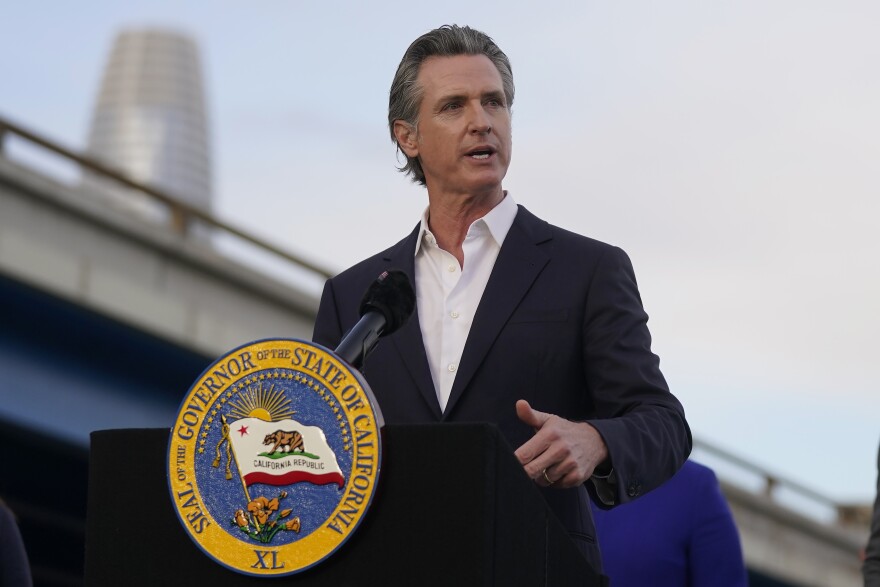 California Gov. Gavin Newsom speaking from a podium.