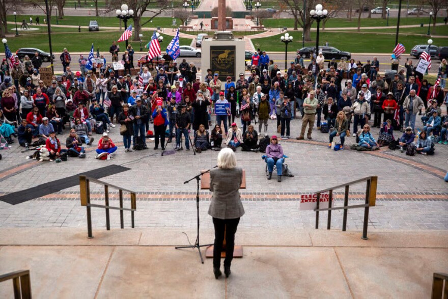 Mesa County Clerk Tina Peters speaks to a crowd of supporters from the Colorado Capitol steps. April 5, 2022.