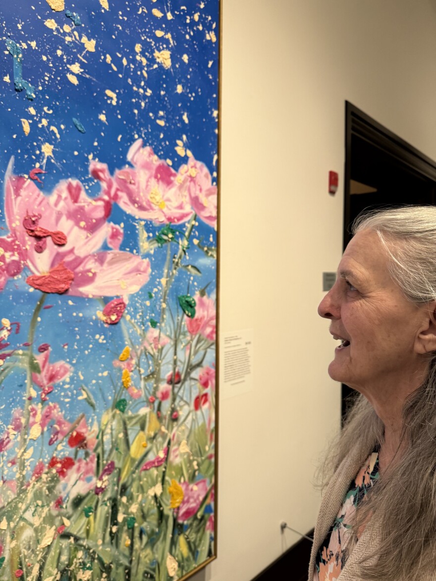 Alzheimer's doesn't keep artist Susan Louise from responding joyously to the dynamic Damien Hirst painting at JSMA