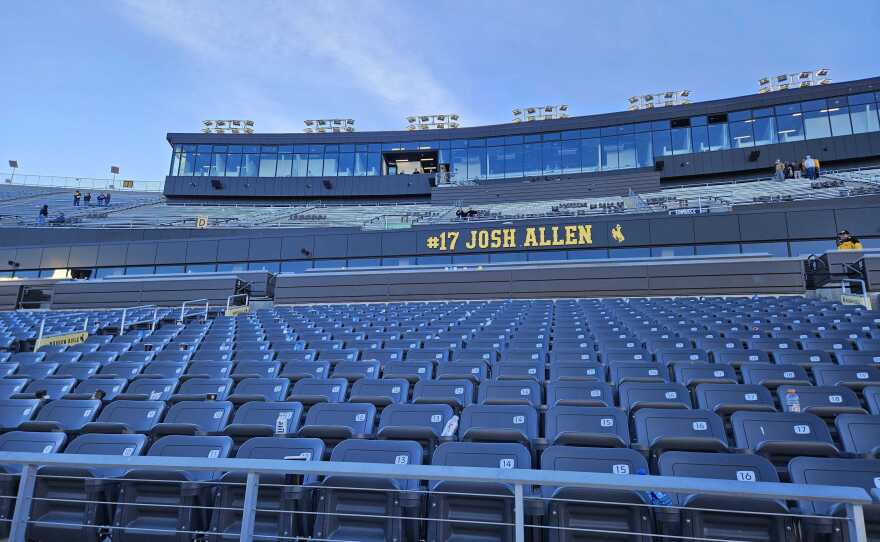 #17 Josh Allen stands out in gold lettering above seating in War Memorial Stadium.