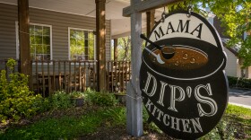 The Mama Dip's Kitchen sign sits outside of the restaurant in Chapel Hill.