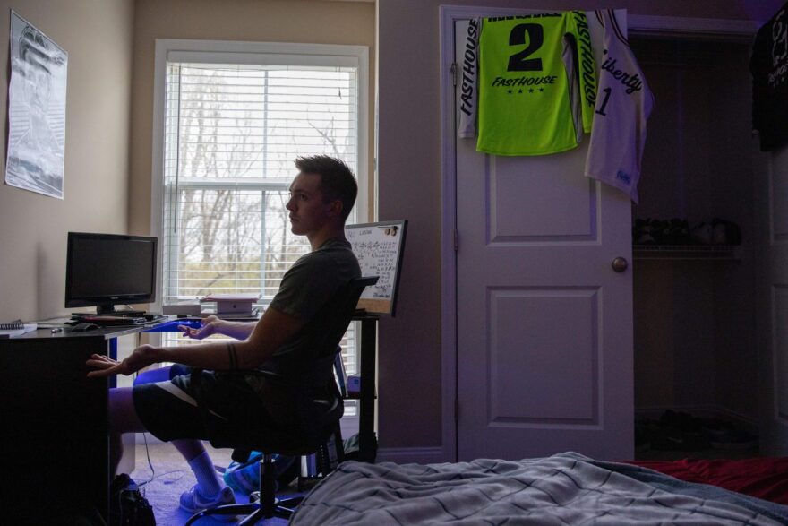 Liberty University student Jared Marshall, sits at his desk inside his apartment near Lynchburg, Virginia.