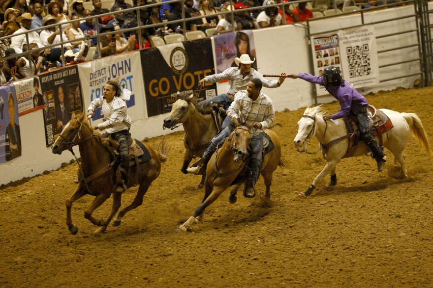 Competitors compete in Pony Express relay races during Texas Black Invitational Rodeo at Fair Park Coliseum, Saturday, July 26, 2025, in Dallas.