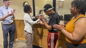 FILE: From left, New Haven Mayor Justin Elicker, Wildaliz Bermudez, Executive Director of the Fair Rent Commission, Annie hardy and Amanda Watts react after signing notarized papers to form a tenant union on June 27, 2023.