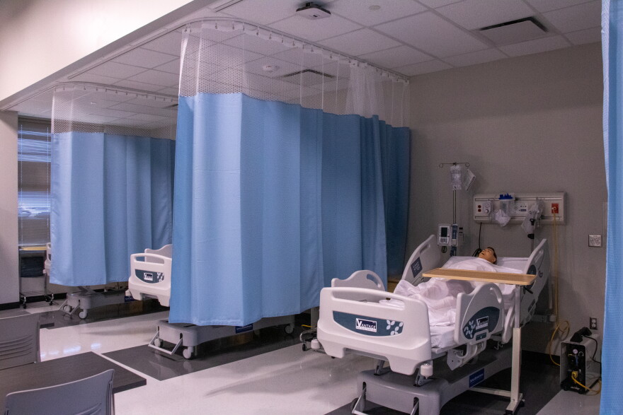 The state-of-the-art mannequins in the healthcare suite at John Marshall Enterprise High School's college and career center can talk to students as they practice caring for a patient.