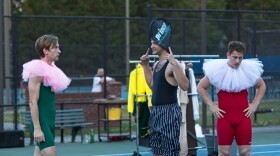 Actors on tennis court