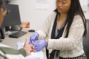 A Vivent Health professional conducts a test on a patient.