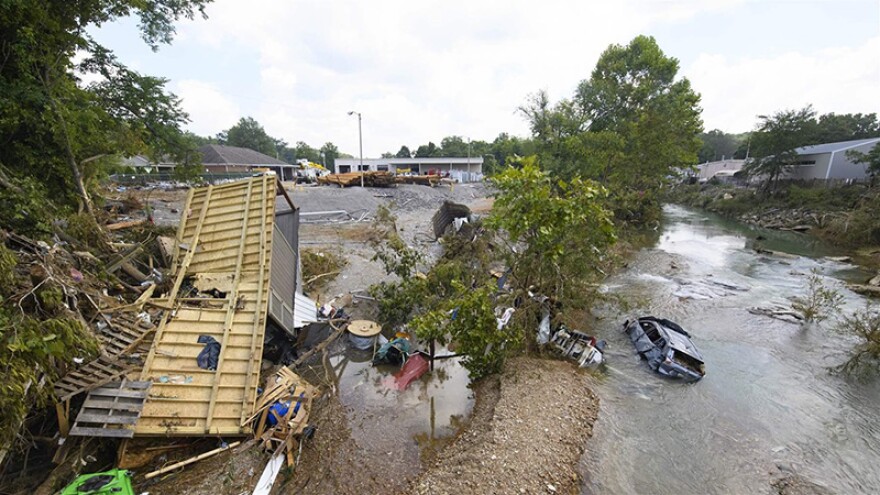 A trailer and car are among the debris swept up by flash flooding in August 2021 in Waverly, Tennessee, that killed up to 20 people and washed away homes and rural roads.