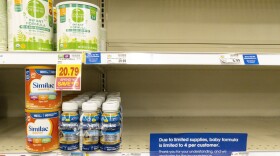 Baby formula is displayed on the shelves of a grocery store with a sign limiting purchases in Indianapolis on Tuesday.