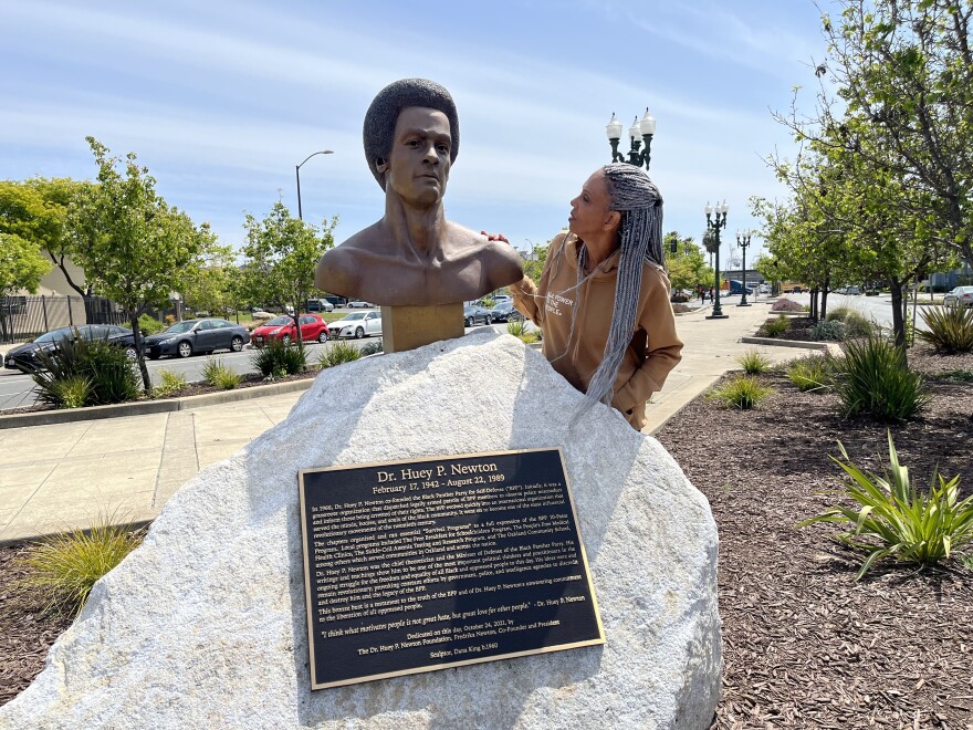 Fredrika Newton stands next the bust of her late husband, Black Panther co-founder Huey P. Newton. NPS is considering a Black Panther Party National Historical Park.