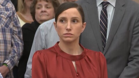 Kouri Richins rises for the jury with the rest of the Summit County courtroom at her murder trial March 4, 2026, outside Park City, Utah.