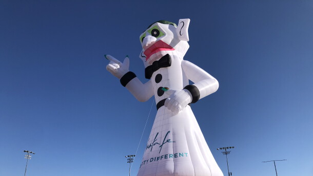 A hot air balloon in the shape of the iconic effigy Zozobra inflates in Santa Fe