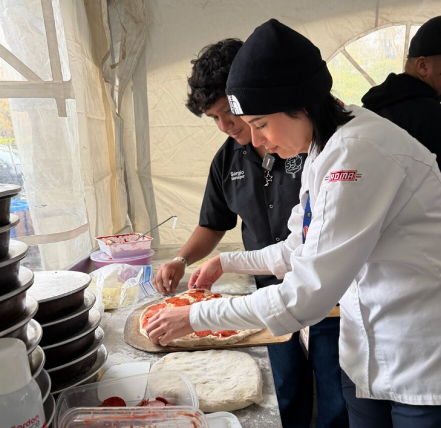 Chef Janet Zapata prepares a pizza at the Pizza Fest Challenge in Montreal.