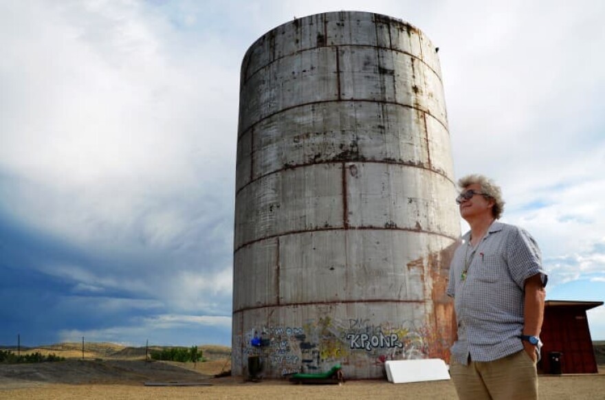 Composer, sound artist and longtime supporter Bruce Odland stands outside The Tank on the outskirts of Rangely, Colo. (Brad Turner/CPR)