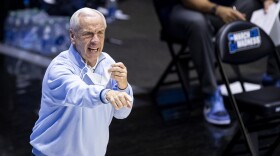 North Carolina head coach Roy Williams directs players during the second half of a first-round game against Wisconsin in the NCAA men's college basketball tournament, Friday, March 19, 2021, at Mackey Arena in West Lafayette, Ind. (AP Photo/Robert Franklin)