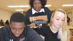 Angela Wright, a computer lab proctor at Hawthorne Middle/High School, works with students. Wright was named this week as one of five finalists for the Florida School-Related Employee of the Year Program award. (Photo courtesy Alachua County schools)