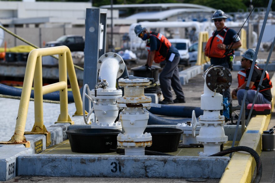 Naval Supply Systems Command Fleet Logistics Center Pearl Harbor fuel distribution system workers prepare to begin an unpacking operation onboard Joint Base Pearl Harbor-Hickam (JBPHH), Hawaiʻi, Oct. 27, 2022. (U.S. Marine Corps photo by Cpl. Luke Cohen)