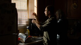 Matthew Frankel with UT's Environmental Clinic inspects a water sample.