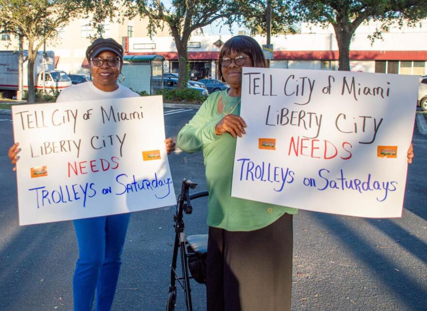 Mary Washington (left) and Annie McGregor (right) rallying for Saturday service at one of the trolley bus stops.