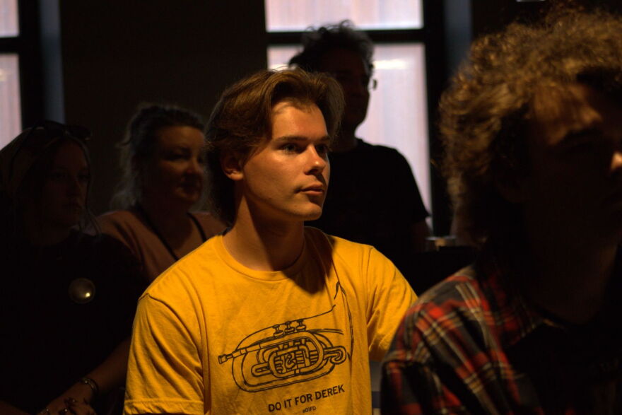 University of Iowa student Tim Lesnik attends a get-out-the-vote rally for Democratic gubernatorial candidate Rob Sand in Iowa City on Oct. 28, 2026.