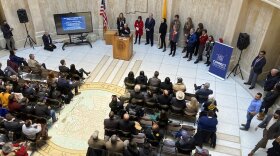 New Mexico Gov. Michelle Lujan Grisham, at podium, speaks about state government support for the film industry in the rotunda of the state Capitol building on Wednesday, Feb. 15, 2023, in Santa Fe, N.M. (AP Photo/Morgan Lee)