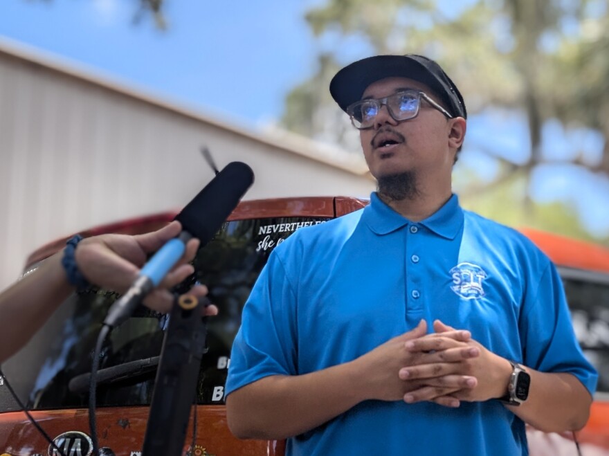 SALT Executive Director Eric Camarillo speaks to Central Florida Public Media behind his organization's main offices in Orlando.