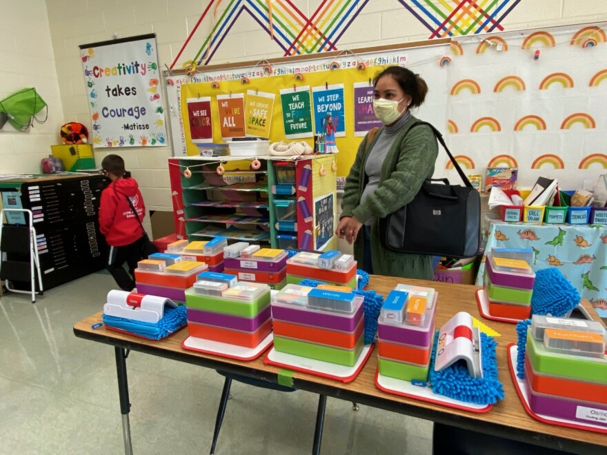 Milagros Macher asks about individual Osmo art and reading kits on a tour of Our Lady of the Assumption School.