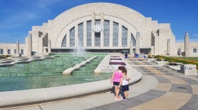 Sophia and Zach Schuster check out the fountain before heading inside the newly reopened Cincinnati Museum Center.